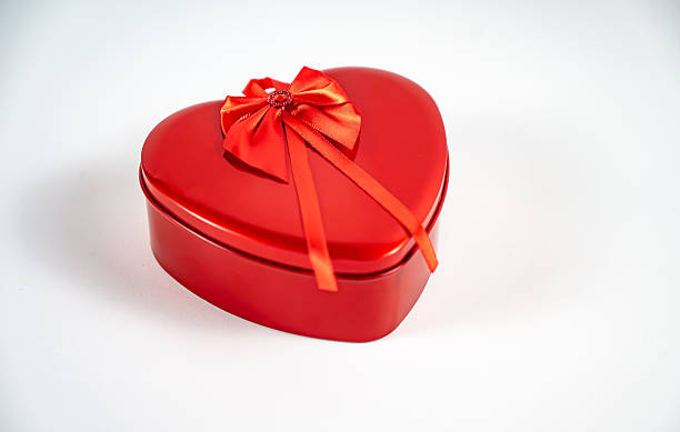 Romantic gift box, heart with roses and teddy bear, white background.